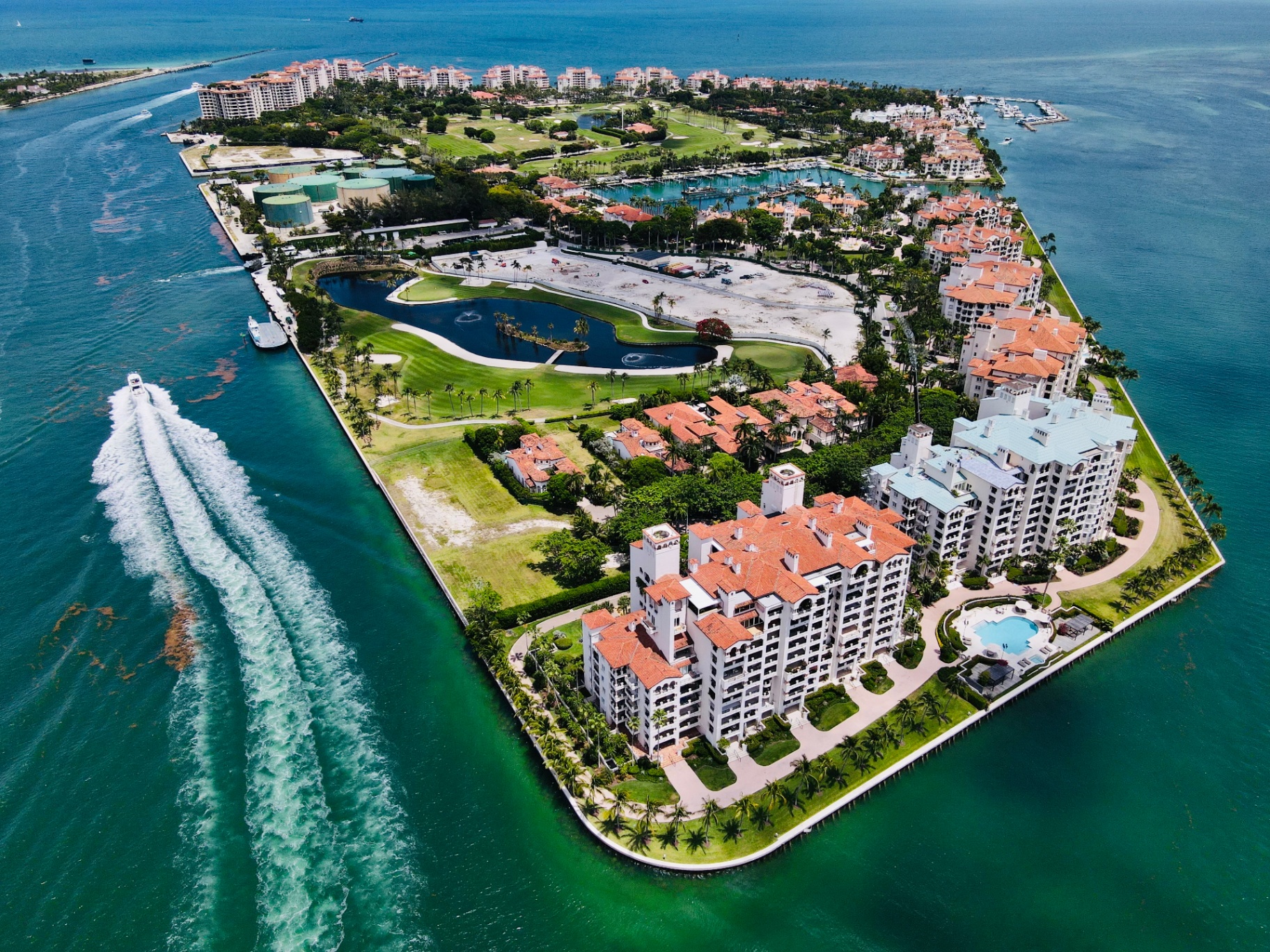 Aerial view of Fisher Island luxury estates, marina and golf course inspected by Home Pro Miami